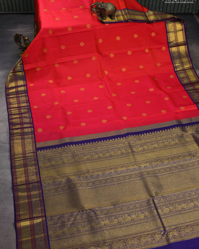 Pure kanchipuram silk saree pinkish orange and blue with zari woven buttas and zari woven korvai border