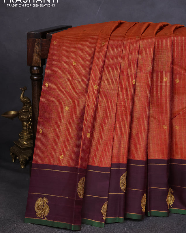 Pure kanchipuram silk saree rustic orange and deep wine with allover small zari checked pattern and annam zari woven butta border