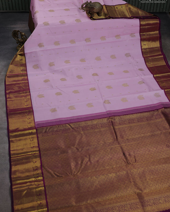 Pure kanchipuram silk saree light pink and purple with annam zari woven buttas and zari woven korvai border