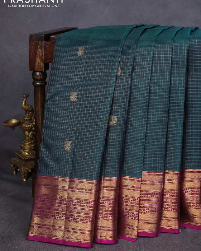 Pure kanchipuram silk saree peacock green and purple with allover zari checks and zari woven border