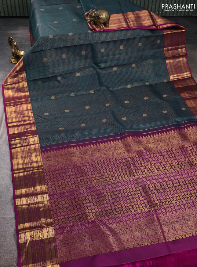 Pure kanchipuram silk saree peacock green and purple with allover zari checks and zari woven border
