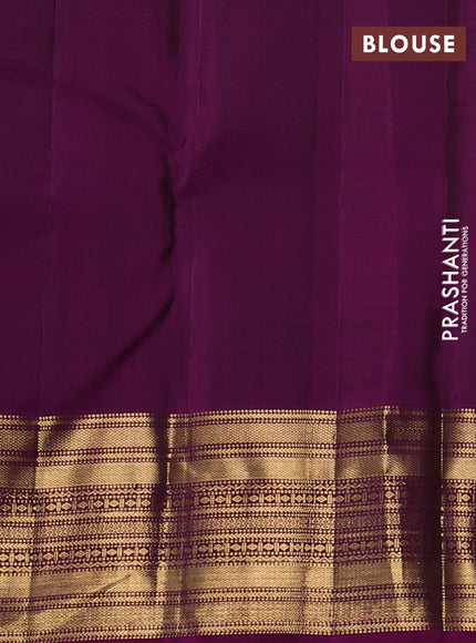 Pure kanchipuram silk saree peacock green and purple with allover zari checks and zari woven border
