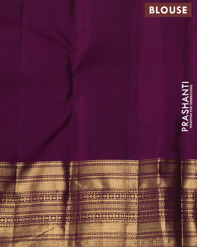 Pure kanchipuram silk saree peacock green and purple with allover zari checks and zari woven border
