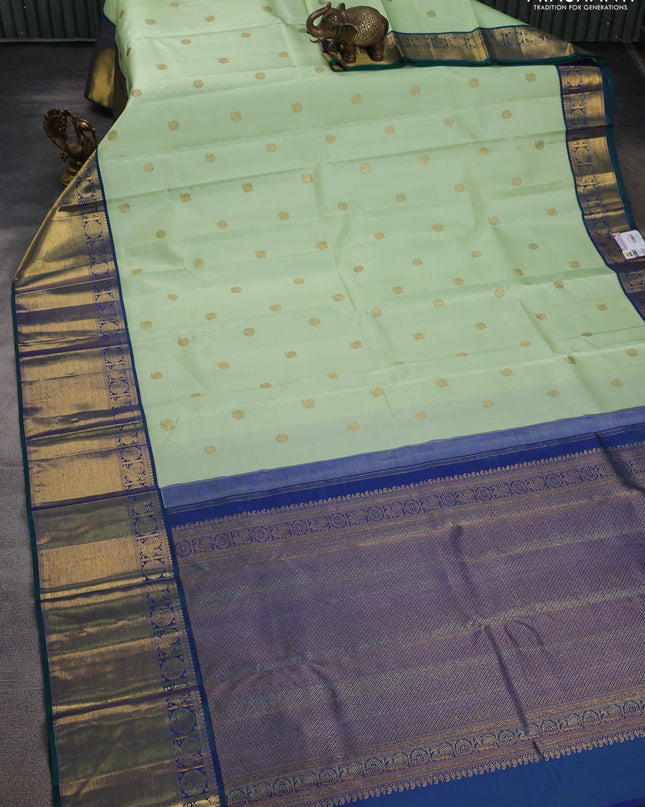 Pure kanchipuram silk saree pista green and dual shade of green with annam zari woven buttas and zari woven border
