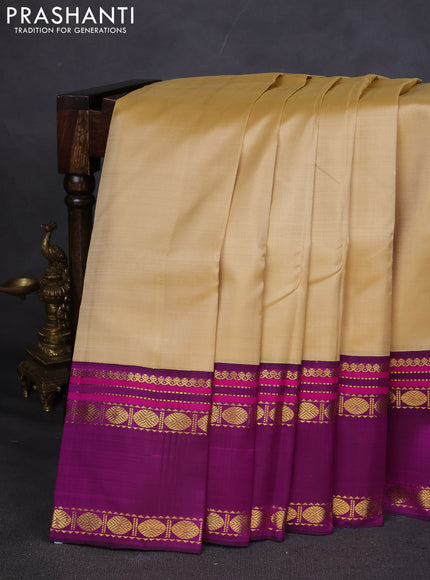 Pure kanchipuram silk saree sandal and purple with plain body and rettapet zari woven border