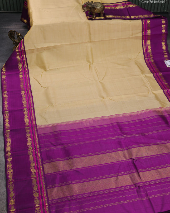 Pure kanchipuram silk saree sandal and purple with plain body and rettapet zari woven border