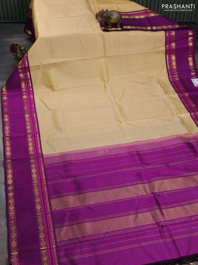 Pure kanchipuram silk saree sandal and purple with plain body and rettapet zari woven border