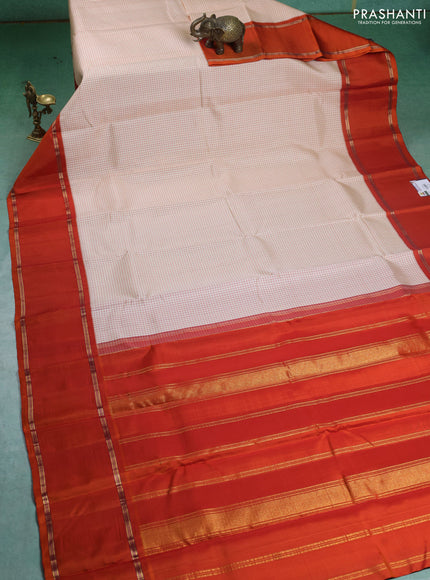 Pure kanchipuram silk saree off white and orange with allover thread woven checked pattern and rettapet zari woven border