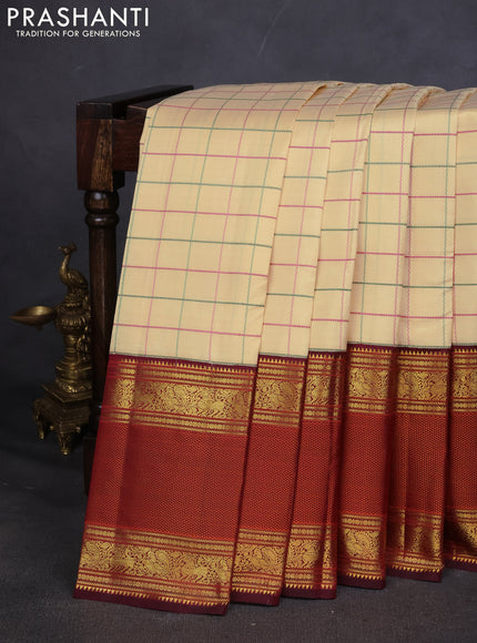 Pure kanchipuram silk saree sandal and deep maroon with allover thread woven checked pattern and long zari woven korvai border