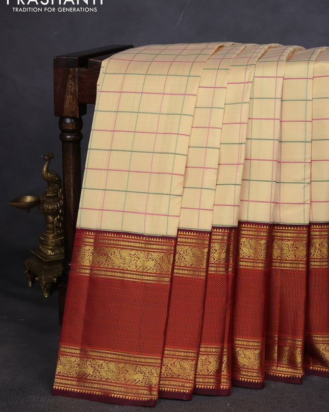 Pure kanchipuram silk saree sandal and deep maroon with allover thread woven checked pattern and long zari woven korvai border