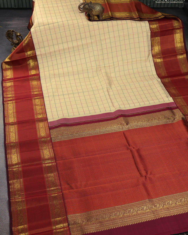 Pure kanchipuram silk saree sandal and deep maroon with allover thread woven checked pattern and long zari woven korvai border