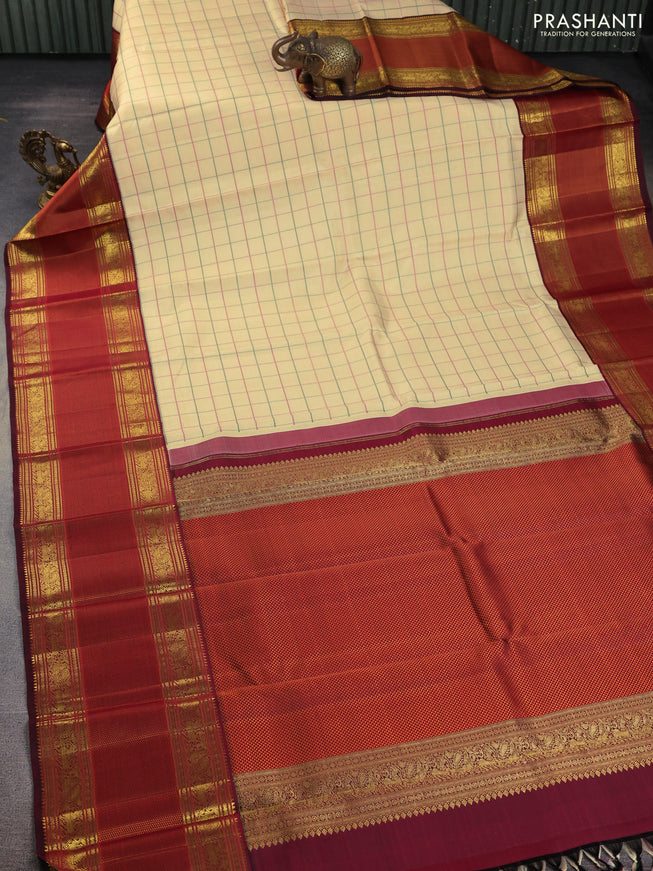 Pure kanchipuram silk saree sandal and deep maroon with allover thread woven checked pattern and long zari woven korvai border