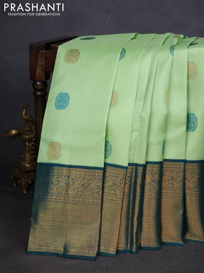 Pure kanchipuram silk saree pista green and peacock green with thread & zari woven buttas and zari woven korvai border