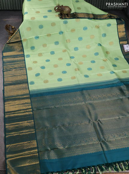 Pure kanchipuram silk saree pista green and peacock green with thread & zari woven buttas and zari woven korvai border