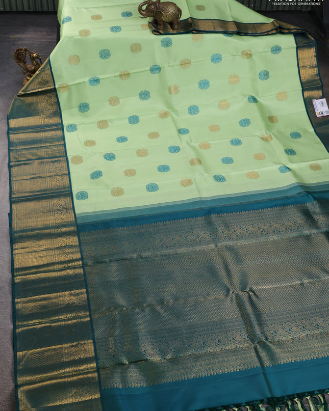 Pure kanchipuram silk saree pista green and peacock green with thread & zari woven buttas and zari woven korvai border