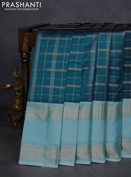 Pure kanchipuram silk saree peacock blue and light blue with allover zari checked pattern and rettapet zari woven border