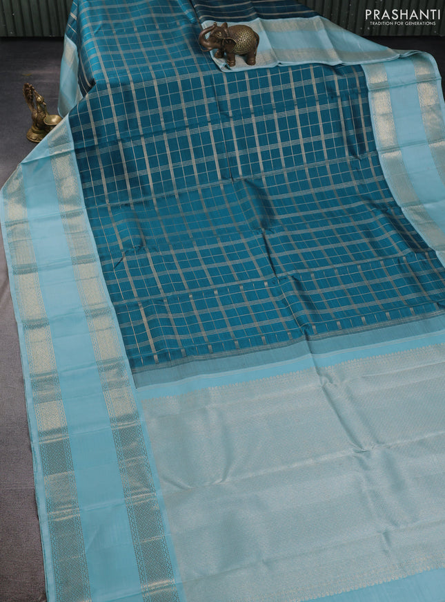Pure kanchipuram silk saree peacock blue and light blue with allover zari checked pattern and rettapet zari woven border