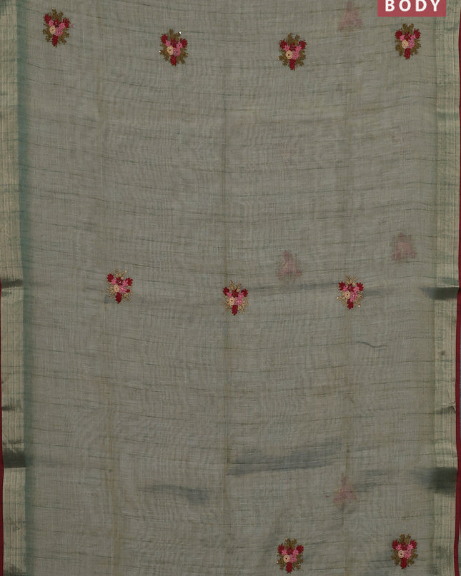 Linen cotton saree green shade and maroon with embroidery buttas and embroidery pallu