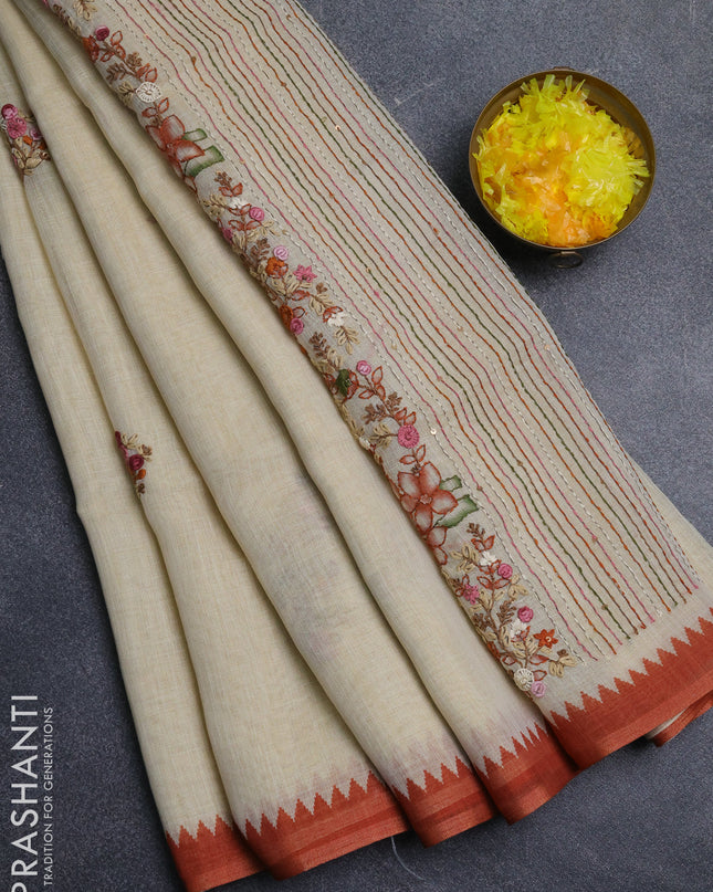 Linen cotton saree cream and rust with embroidery buttas and embroidery pallu