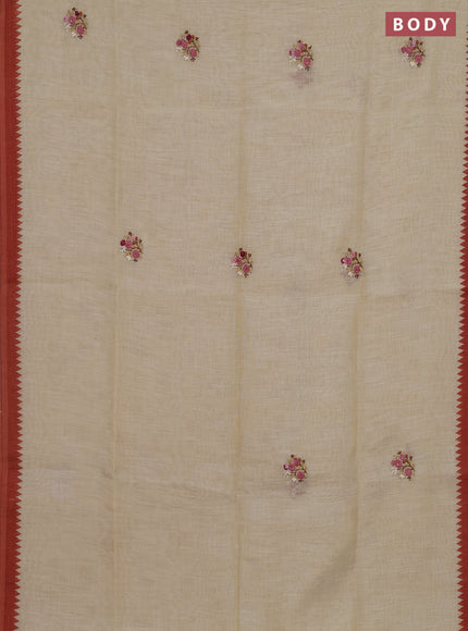 Linen cotton saree cream and rust with embroidery buttas and embroidery pallu