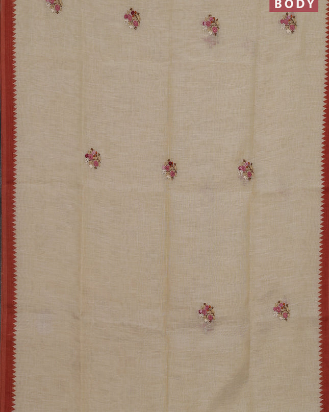 Linen cotton saree cream and rust with embroidery buttas and embroidery pallu