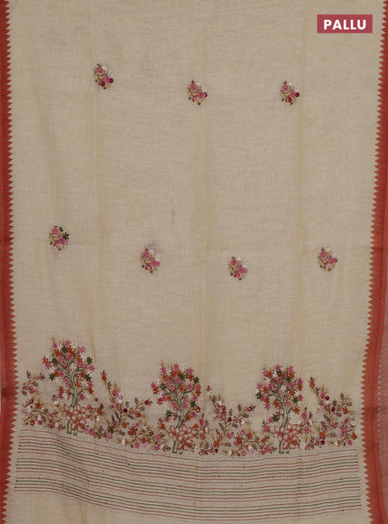 Linen cotton saree cream and rust with embroidery buttas and embroidery pallu