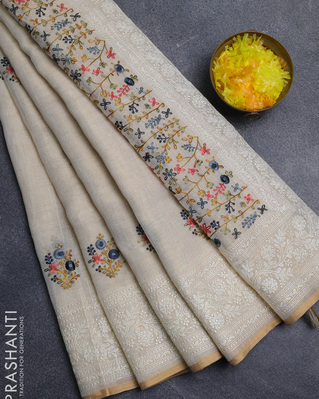 Linen cotton saree cream with embroidery buttas and embroidery pallu