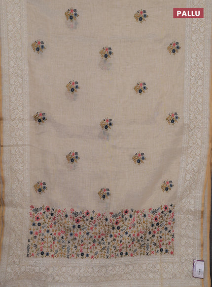 Linen cotton saree cream with embroidery buttas and embroidery pallu