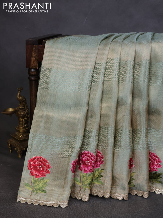 Banarasi silk saree pastel green with allover zari weaves and floral design embroidery border
