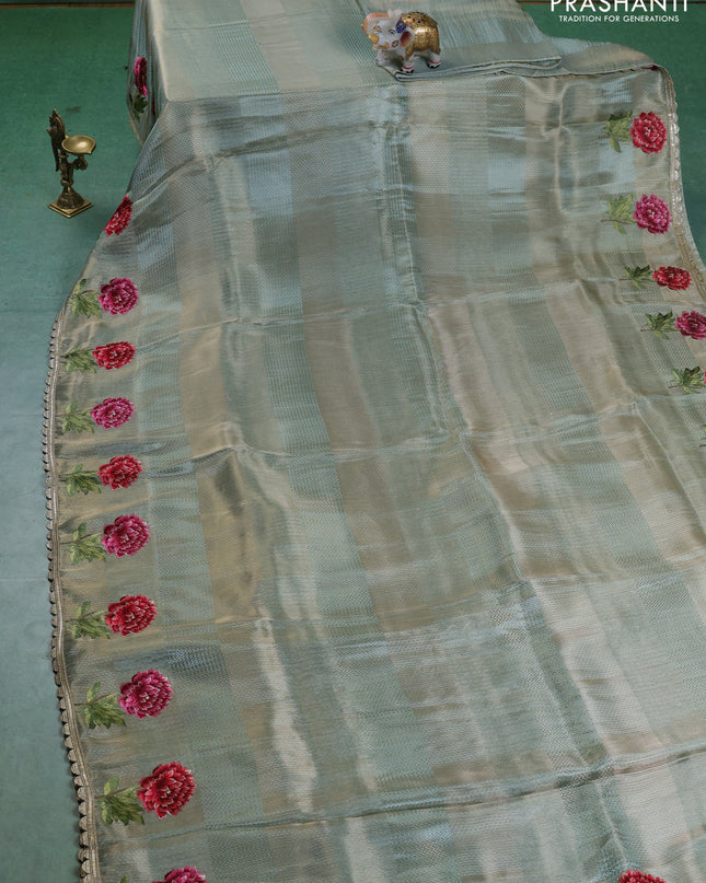 Banarasi silk saree pastel green with allover zari weaves and floral design embroidery border