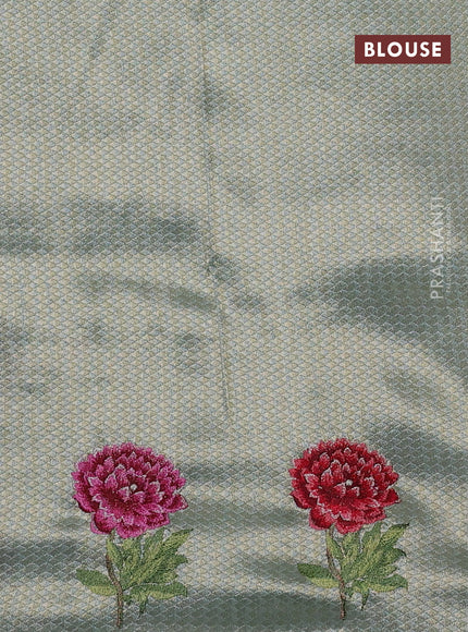 Banarasi silk saree pastel green with allover zari weaves and floral design embroidery border