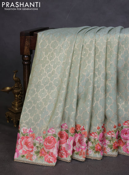 Banarasi silk saree pastel green with allover geometric zari weaves and floral design embroidery border