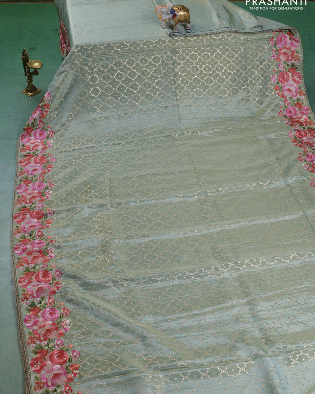 Banarasi silk saree pastel green with allover geometric zari weaves and floral design embroidery border