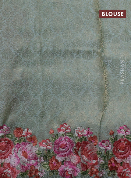 Banarasi silk saree pastel green with allover geometric zari weaves and floral design embroidery border