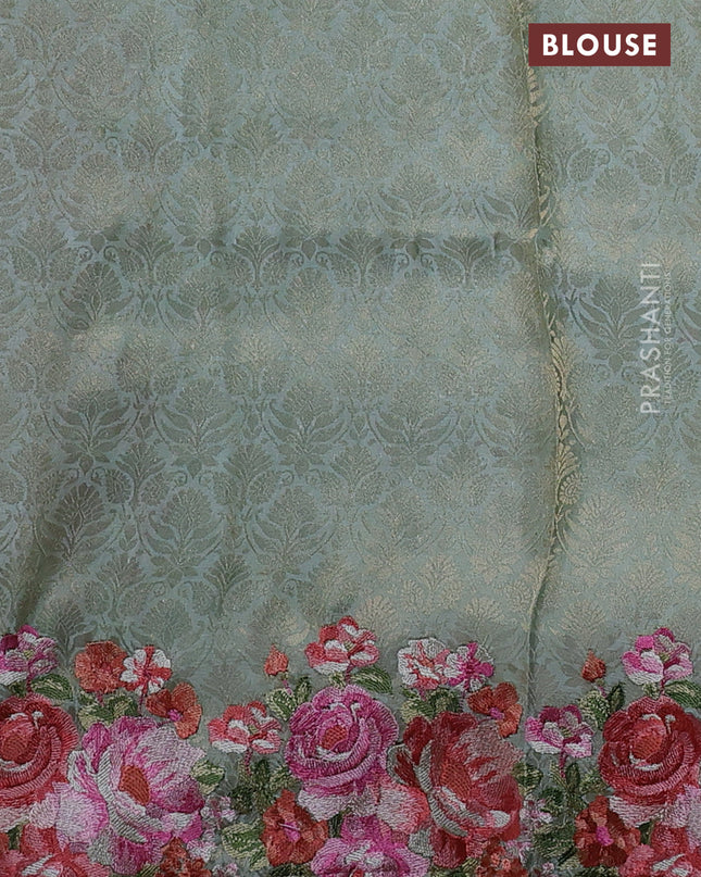Banarasi silk saree pastel green with allover geometric zari weaves and floral design embroidery border