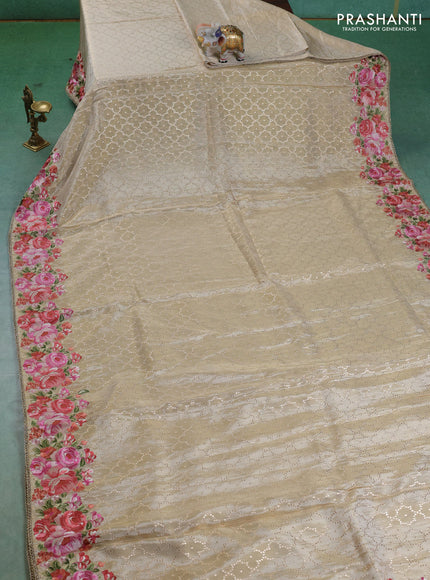 Banarasi silk saree beige with allover geometric zari weaves and floral design embroidery border