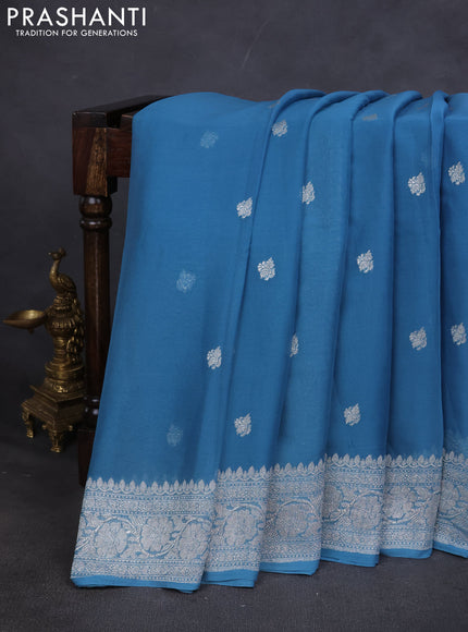Pure banarasi chiffon saree blue shade with silver zari woven buttas and silver zari woven border