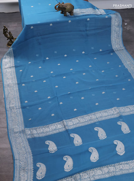 Pure banarasi chiffon saree blue shade with silver zari woven buttas and silver zari woven border