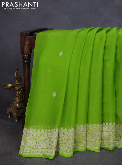 Pure banarasi chiffon saree fluorescent green with silver zari woven buttas and silver zari woven border