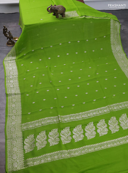 Pure banarasi chiffon saree fluorescent green with silver zari woven buttas and silver zari woven border