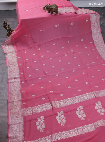 Pure banarasi chiffon saree peach pink with silver zari woven buttas and silver zari woven border