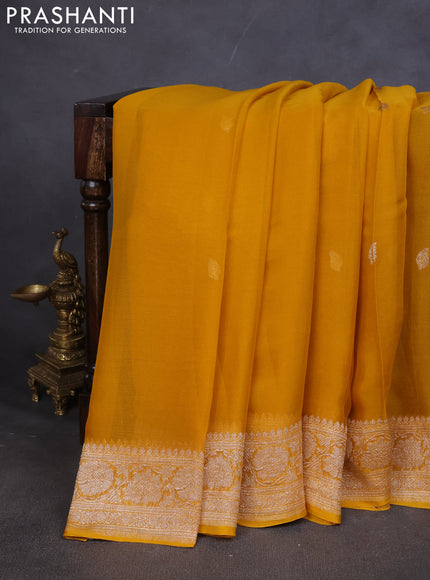 Pure banarasi chiffon saree mustard yellow with silver zari woven buttas and silver zari woven border