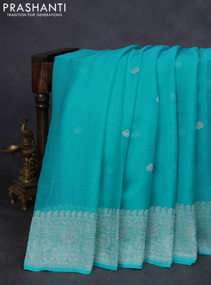 Pure banarasi chiffon saree teal blue with silver zari woven buttas and silver zari woven border
