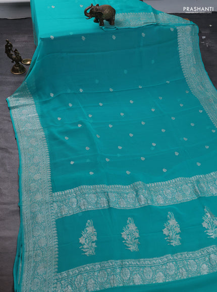 Pure banarasi chiffon saree teal blue with silver zari woven buttas and silver zari woven border