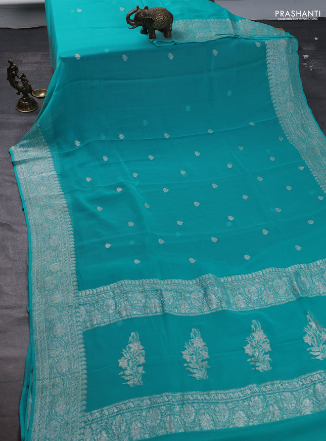 Pure banarasi chiffon saree teal blue with silver zari woven buttas and silver zari woven border