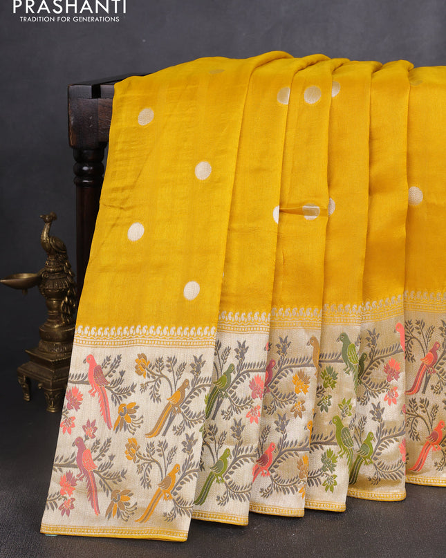 Banarasi semi raw silk saree mustard yellow with silver zari woven coin buttas and mina border