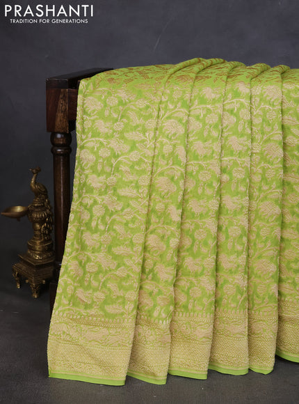 Pure banarasi georgette saree fluorescent green with allover zari weaves and woven border