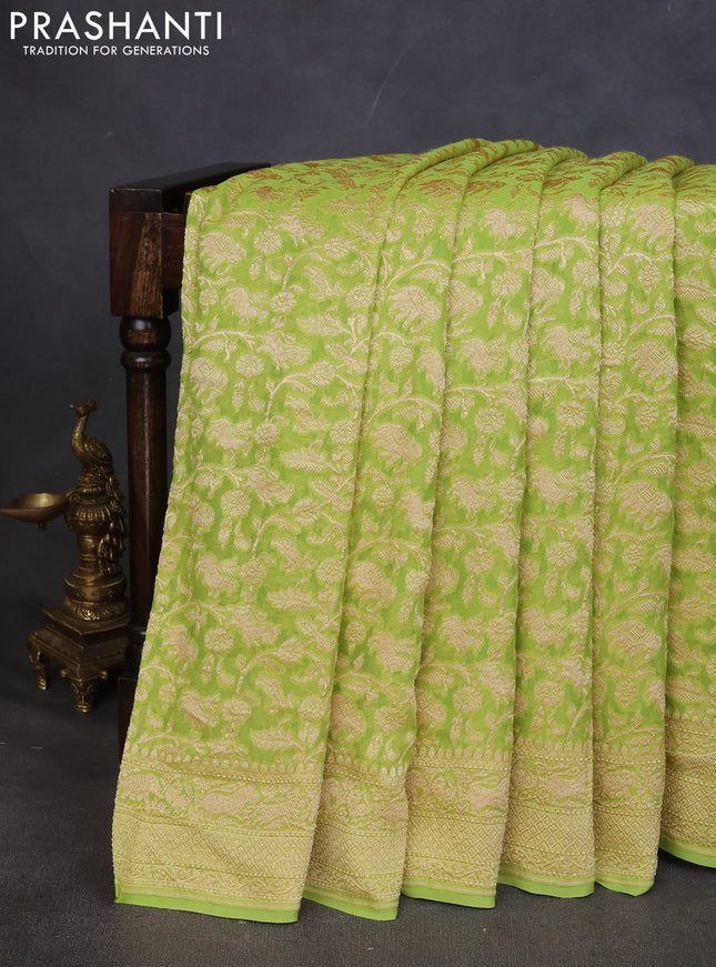Pure banarasi georgette saree fluorescent green with allover zari weaves and woven border