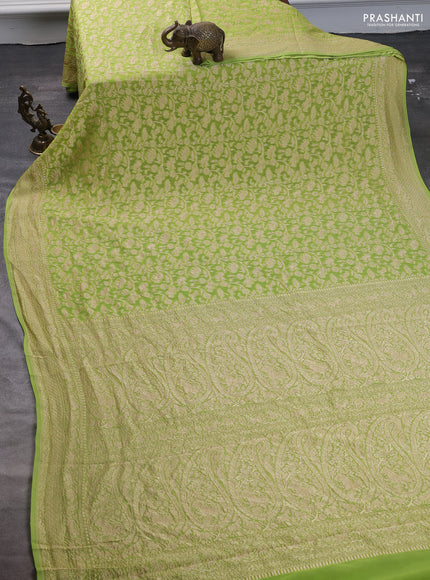 Pure banarasi georgette saree fluorescent green with allover zari weaves and woven border