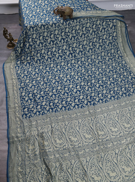 Pure banarasi georgette saree peacock blue with allover zari weaves and woven border